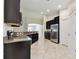 Modern kitchen with stainless steel appliances and granite countertops, lots of storage at 11506 Mansfield Point Dr, Riverview, FL 33569