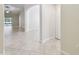 Bright and airy living room with vaulted ceilings and neutral tile flooring at 11506 Mansfield Point Dr, Riverview, FL 33569