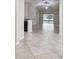 Spacious living room featuring vaulted ceilings and neutral tiled floors with view to the outside at 11506 Mansfield Point Dr, Riverview, FL 33569