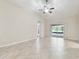 Spacious living room featuring tile floors and sliding glass doors leading to an outdoor area at 11506 Mansfield Point Dr, Riverview, FL 33569