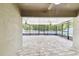 A screened patio with an abundance of natural light and open space at 11506 Mansfield Point Dr, Riverview, FL 33569
