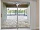 The expansive screened-in patio features stone flooring, fan and backyard views at 11506 Mansfield Point Dr, Riverview, FL 33569