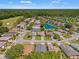 Aerial view of a residential neighborhood with a pond and a golf course at 11800 Ivywood Pl, New Port Richey, FL 34654