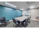 Community conference room featuring an oblong table, chairs and a blue accent wall at 11800 Ivywood Pl, New Port Richey, FL 34654
