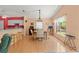 Dining area with wood floors and barstool seating to the kitchen at 11800 Ivywood Pl, New Port Richey, FL 34654