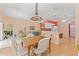 Dining area with wood-look flooring and a modern pendant light at 11800 Ivywood Pl, New Port Richey, FL 34654