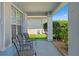 Inviting front porch featuring neutral toned furniture and lovely plants at 11800 Ivywood Pl, New Port Richey, FL 34654