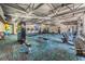 Well-equipped fitness center with treadmills, weights, and exercise machines for a complete workout at 11800 Ivywood Pl, New Port Richey, FL 34654