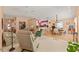 Open-concept living room with carpet and view to the kitchen and dining area at 11800 Ivywood Pl, New Port Richey, FL 34654