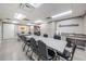 Community center meeting room with tables, chairs, storage, and refreshment area at 11800 Ivywood Pl, New Port Richey, FL 34654