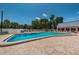 Beautiful community pool with clear water, a brick deck, and a variety of seating options at 11800 Ivywood Pl, New Port Richey, FL 34654