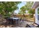 Back deck with table and chairs overlooks a spacious backyard at 1253 Union St, Clearwater, FL 33755