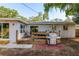 Backyard featuring a wooden deck, patio, grill, and seating at 1253 Union St, Clearwater, FL 33755