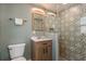 Bathroom with a modern vanity and a shower featuring decorative tile and a glass door at 1253 Union St, Clearwater, FL 33755
