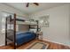 Bedroom with bunkbeds, hard wood flooring, and a bright window at 1253 Union St, Clearwater, FL 33755