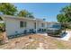 Charming single-story home with a well-maintained front yard featuring minimalist rock and modern SUV at 1253 Union St, Clearwater, FL 33755