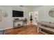 Open living area with a large screen television and stylish coastal decor at 1253 Union St, Clearwater, FL 33755