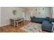 Cozy living room featuring a stylish blue sofa and a wooden dining table set at 1253 Union St, Clearwater, FL 33755