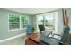 Bright office space with a large window, sliding glass door, and outdoor views at 1253 Union St, Clearwater, FL 33755