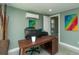 Functional office space with desk, decor, and access to an adjacent bathroom at 1253 Union St, Clearwater, FL 33755