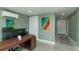 Home office with desk, artwork, and easy access to additional rooms at 1253 Union St, Clearwater, FL 33755