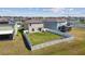 Aerial view of a fenced backyard featuring a well-manicured lawn and seating at 12775 Maple Bonsai Dr, Riverview, FL 33579