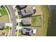 An aerial view of the house showcasing its position on a well-developed street near the lake at 12775 Maple Bonsai Dr, Riverview, FL 33579