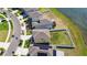 An aerial view shows the house and its position near the lake, located near a well-developed neighborhood at 12775 Maple Bonsai Dr, Riverview, FL 33579