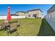 Large backyard with green grass and furniture at 12775 Maple Bonsai Dr, Riverview, FL 33579