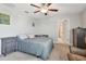 Comfortable bedroom with a ceiling fan, dresser, nightstand, and neutral walls at 12775 Maple Bonsai Dr, Riverview, FL 33579