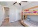 Bedroom featuring a bunk bed, ceiling fan, and carpet at 12775 Maple Bonsai Dr, Riverview, FL 33579
