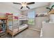 Cozy bedroom featuring a bunk bed, white dresser and a window with natural light at 12775 Maple Bonsai Dr, Riverview, FL 33579