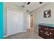 Neutral bedroom featuring a closet, ceiling fan and a dresser with a changing pad at 12775 Maple Bonsai Dr, Riverview, FL 33579