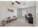 Bright bonus room featuring neutral walls, ceiling fan, window, and carpet at 12775 Maple Bonsai Dr, Riverview, FL 33579