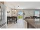 Bright dining area with tile flooring and sliding glass doors leading to outdoor space at 12775 Maple Bonsai Dr, Riverview, FL 33579