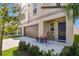 Well-maintained two-story home with a brown garage door and a beautifully landscaped entrance at 12775 Maple Bonsai Dr, Riverview, FL 33579