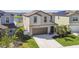 Charming two-story home with a well-manicured lawn and inviting front entrance at 12775 Maple Bonsai Dr, Riverview, FL 33579