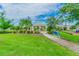 Picturesque community gazebo with American flag and lush landscaping, offering a serene outdoor gathering space at 12775 Maple Bonsai Dr, Riverview, FL 33579