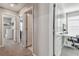 Hallway with multiple white doors leading to other rooms in the home at 12775 Maple Bonsai Dr, Riverview, FL 33579