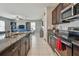 Open kitchen features granite countertops, stainless steel appliances and a seamless flow into the living area at 12775 Maple Bonsai Dr, Riverview, FL 33579