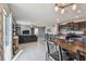 Spacious open concept living and dining area with tile flooring and natural light at 12775 Maple Bonsai Dr, Riverview, FL 33579