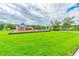 Expansive green lawn features a community playground and gazebo, perfect for outdoor activities and gatherings at 12775 Maple Bonsai Dr, Riverview, FL 33579