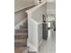 Carpeted staircase featuring white trim and grey walls, leading to the upper level of the home at 12775 Maple Bonsai Dr, Riverview, FL 33579