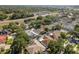 Aerial view of a neighborhood with houses, pools, and mature trees at 1285 Salt Lake Dr, Tarpon Springs, FL 34689