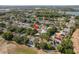 Aerial view showing home's location within the community, with nearby lake at 1285 Salt Lake Dr, Tarpon Springs, FL 34689