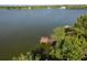 Scenic aerial view of a wooden dock on a calm waterway, perfect for boating and recreation at 1285 Salt Lake Dr, Tarpon Springs, FL 34689
