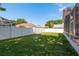 Spacious backyard with lush green grass and privacy fence at 1285 Salt Lake Dr, Tarpon Springs, FL 34689