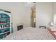 Cozy bedroom featuring a fireplace, built-in shelving, and a serene ambiance for relaxation and rest at 1285 Salt Lake Dr, Tarpon Springs, FL 34689