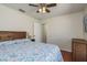 Cozy bedroom featuring wood floors, queen bed, and modern decor at 1285 Salt Lake Dr, Tarpon Springs, FL 34689