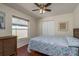 Bedroom boasting hardwood floors, a bed with a patterned quilt, and a ceiling fan for added comfort at 1285 Salt Lake Dr, Tarpon Springs, FL 34689